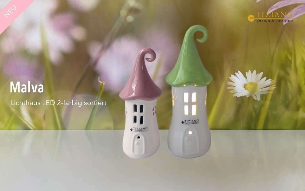 Zwei bezaubernde LED-Lichthäuser in den Farben Rosa und Grün, entworfen von Tiziano, vor einem floralen Hintergrund. Ideal für die Inneneinrichtung und die Aufwertung des Ambientes.